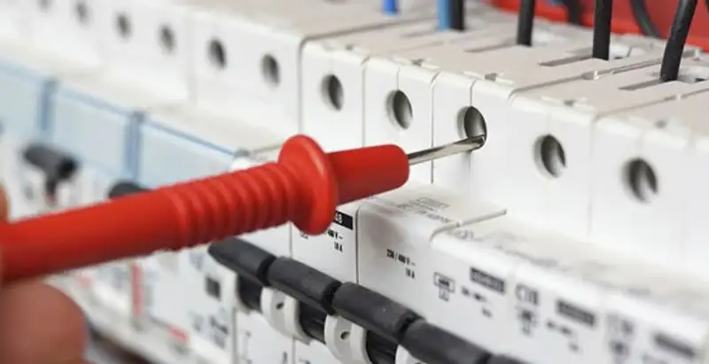 Electrical contractor testing circuit breakers during electrical repair in Carolina Beach, NC