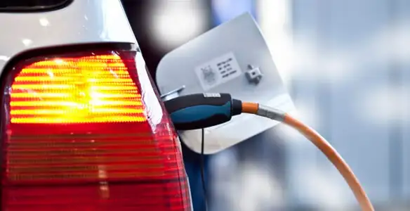 Electric car plugged into EV charger after professional installation in Wilmington, NC