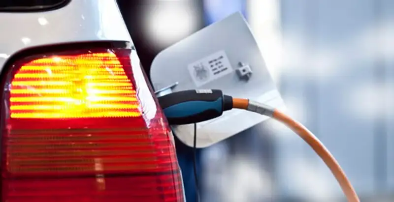 Electric car plugged into EV charger after professional installation in Wilmington, NC