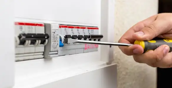 electrical panel upgrade service showing technician adjusting circuit breakers during system upgrade in Wilmington, NC