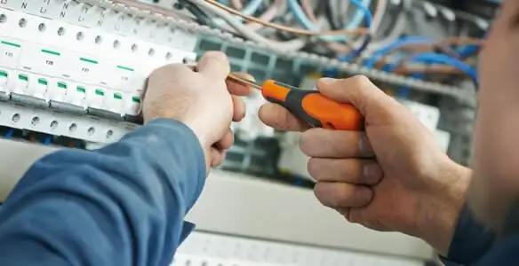 electrical service showing licensed electrician performing electrical panel maintenance and adjustments in Wilmington, NC