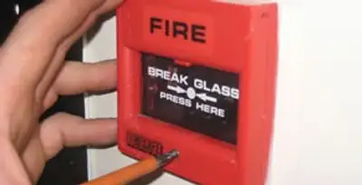 fire alarm installation service showing manual fire alarm pull station installed by licensed electricians in Wilmington, NC