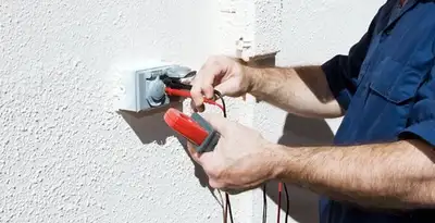 Electrician performing home electrical outlet and wiring inspection in Wilmington, NC