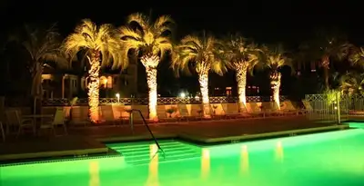 landscape lighting installation services illuminating outdoor recreational areas in Wilmington, NC