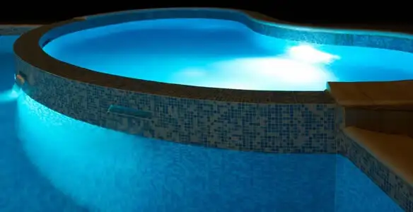 pool light installation and repair services highlighting illuminated pool interior lighting in Wilmington, NC