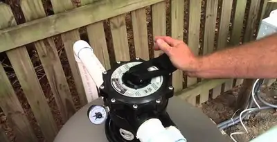 pool pumps service showing professional adjustment of pool pump control system in Wilmington, NC