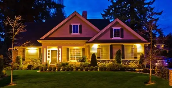 security light installation services illuminating a residential exterior at night in Wilmington, NC