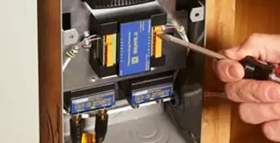 Whole home surge protection device being installed by a licensed electrician to protect electrical systems in Wilmington, NC